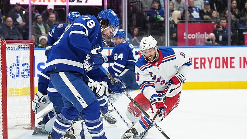 Dec 19, 2023; Toronto, Ontario, CAN; Toronto Maple Leafs defenseman TJ Brodie (78) battles for the puck with New York Rangers center Vincent Trocheck (16) during the second period at Scotiabank Arena. Mandatory Credit: Nick Turchiaro-USA TODAY Sports