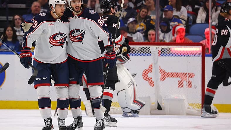 Dec 19, 2023; Buffalo, New York, USA; Columbus Blue Jackets right wing Kirill Marchenko (86) celebrates his goal with teammates during the second period against the Buffalo Sabres at KeyBank Center. Mandatory Credit: Timothy T. Ludwig-USA TODAY Sports
