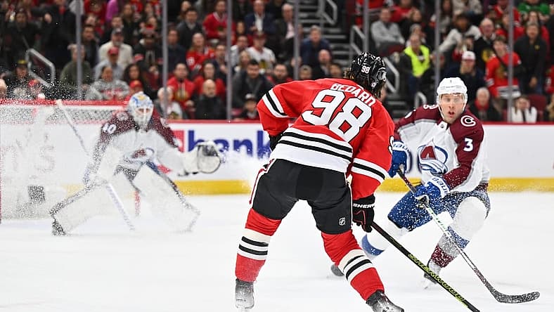 Dec 19, 2023; Chicago, Illinois, USA; Chicago Blackhawks forward Connor Bedard (98) attempts a shot on goal in the first period against the Colorado Avalanche at United Center. Mandatory Credit: Jamie Sabau-USA TODAY Sports