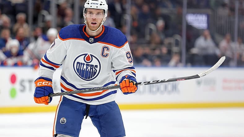 Dec 19, 2023; Elmont, New York, USA; Edmonton Oilers center Connor McDavid (97) skates against the New York Islanders during the first period at UBS Arena. Mandatory Credit: Brad Penner-USA TODAY Sports