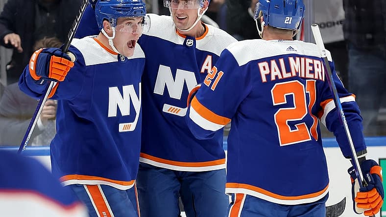 Dec 19, 2023; Elmont, New York, USA; New York Islanders center Bo Horvat (14) celebrates his goal against the Edmonton Oilers with center Brock Nelson (29) and center Kyle Palmieri (21) during the second period at UBS Arena. Mandatory Credit: Brad Penner-USA TODAY Sports