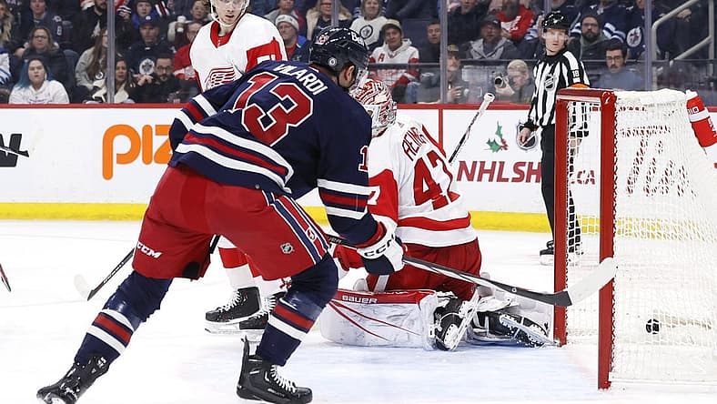 Dec 20, 2023; Winnipeg, Manitoba, CAN; Winnipeg Jets center Gabriel Vilardi (13) scores on Detroit Red Wings goaltender James Reimer (47) in the second period at Canada Life Centre. Mandatory Credit: James Carey Lauder-USA TODAY Sports