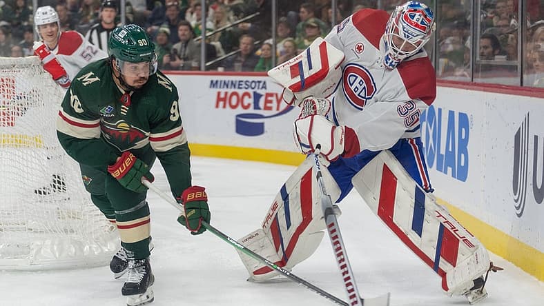 Dec 21, 2023; Saint Paul, Minnesota, USA; Minnesota Wild left wing Marcus Johansson (90) steals the puck behind the net from Montreal Canadiens goaltender Sam Montembeault (35) in the first period at Xcel Energy Center. Mandatory Credit: Matt Blewett-USA TODAY Sports