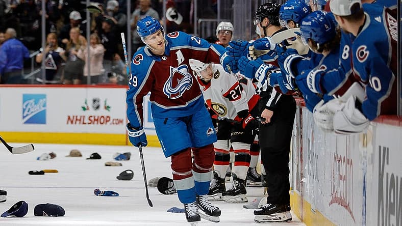 Dec 21, 2023; Denver, Colorado, USA; Colorado Avalanche center Nathan MacKinnon (29) celebrates his hat trick goal with the bench in the third period against the Ottawa Senators at Ball Arena. Mandatory Credit: Isaiah J. Downing-USA TODAY Sports