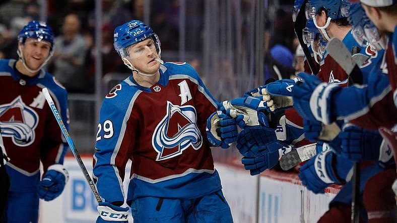 Dec 21, 2023; Denver, Colorado, USA; Colorado Avalanche center Nathan MacKinnon (29) celebrates with the bench after his fourth goal of the game against the Ottawa Senators at Ball Arena. Mandatory Credit: Isaiah J. Downing-USA TODAY Sports