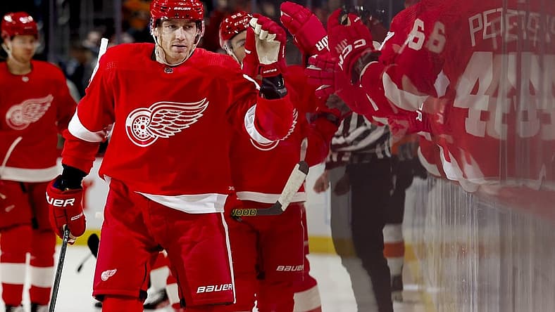Dec 22, 2023; Detroit, Michigan, USA; Detroit Red Wings right wing Patrick Kane (88) receives congratulations from teammates after scoring in the first period against the Philadelphia Flyers at Little Caesars Arena. Mandatory Credit: Rick Osentoski-USA TODAY Sports