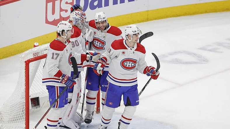 Dec 22, 2023; Chicago, Illinois, USA; Montreal Canadiens goaltender Cayden Primeau (30) celebrates with teammates after defeating the Chicago Blackhawks at United Center. Mandatory Credit: Kamil Krzaczynski-USA TODAY Sports