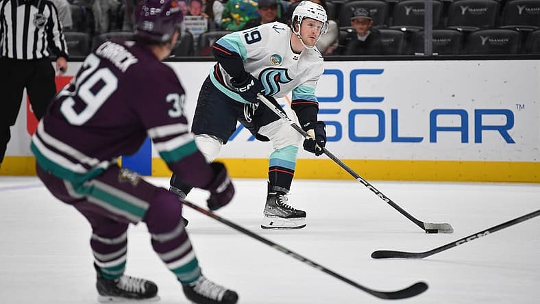 Dec 23, 2023; Anaheim, California, USA; Seattle Kraken left wing Jared McCann (19) moves in for a shot against the Anaheim Ducks during the first period at Honda Center. Mandatory Credit: Gary A. Vasquez-USA TODAY Sports