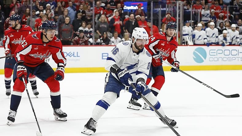 Dec 23, 2023; Washington, District of Columbia, USA; Tampa Bay Lightning right wing Nikita Kucherov (86) skates with the puck as Washington Capitals defenseman Martin Fehervary (42) defends in the second period at Capital One Arena. Mandatory Credit: Geoff Burke-USA TODAY Sports