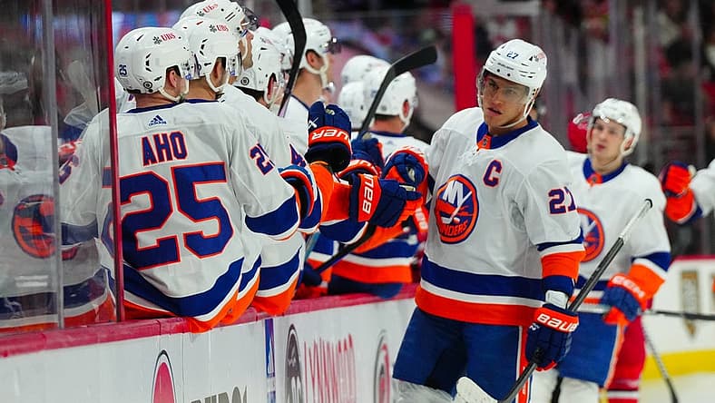 Dec 23, 2023; Raleigh, North Carolina, USA; New York Islanders left wing Anders Lee (27) celebrates his goal against the Carolina Hurricanes during the third period at PNC Arena. Mandatory Credit: James Guillory-USA TODAY Sports