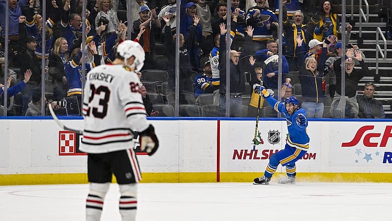 Dec 23, 2023; St. Louis, Missouri, USA;  St. Louis Blues center Jordan Kyrou (25) reacts after scoring against the Chicago Blackhawks during the third period at Enterprise Center. Mandatory Credit: Jeff Curry-USA TODAY Sports
