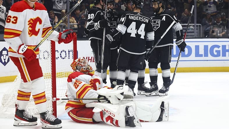 Dec 23, 2023; Los Angeles, California, USA; Los Angeles Kings right wing Alex Laferriere (78) celebrates with his teammates after scoring a goal against the Calgary Flames during the second period at Crypto.com Arena. Mandatory Credit: Jessica Alcheh-USA TODAY Sports