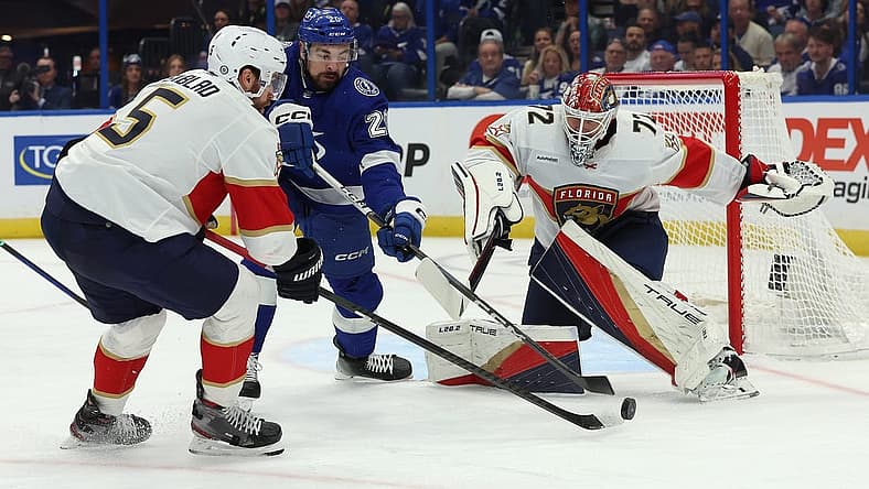 Dec 27, 2023; Tampa, Florida, USA; Florida Panthers defenseman Aaron Ekblad (5), Tampa Bay Lightning left wing Nicholas Paul (20) and Florida Panthers goaltender Sergei Bobrovsky (72) go after the puck during the first period at Amalie Arena. Mandatory Credit: Kim Klement Neitzel-USA TODAY Sports