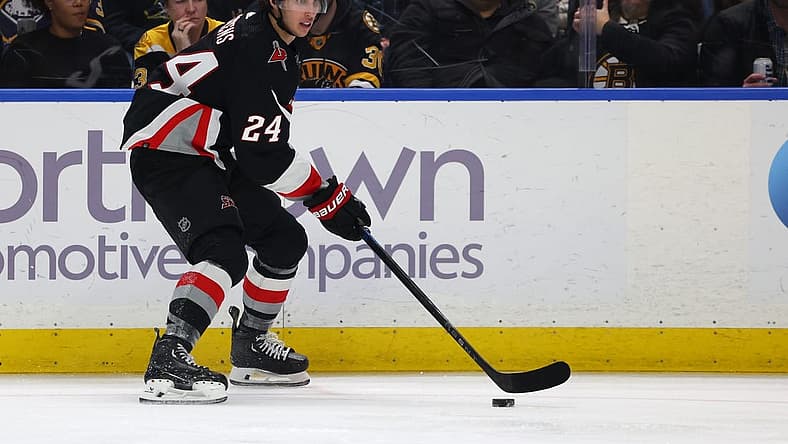 Dec 27, 2023; Buffalo, New York, USA;  Buffalo Sabres center Dylan Cozens (24) looks to make a pass during the second period against the Boston Bruins at KeyBank Center. Mandatory Credit: Timothy T. Ludwig-USA TODAY Sports