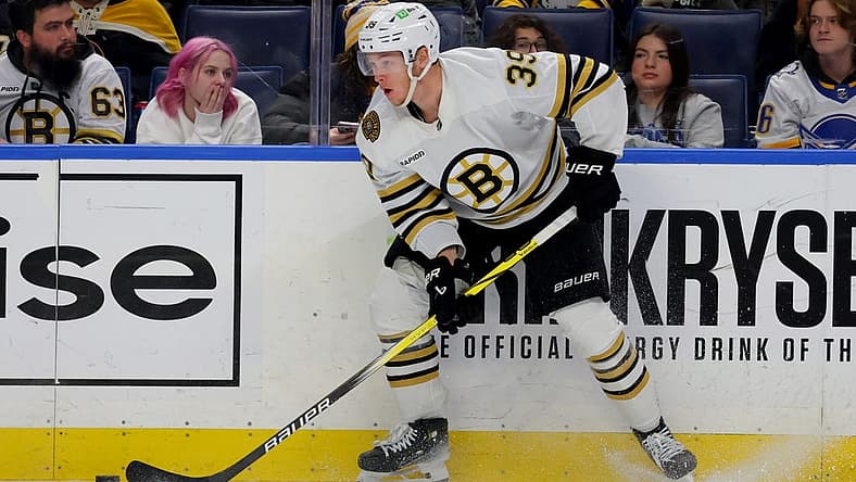 Dec 27, 2023; Buffalo, New York, USA; Boston Bruins center Morgan Geekie (39) looks to make a pass during the third period against the Buffalo Sabres at KeyBank Center. Mandatory Credit: Timothy T. Ludwig-USA TODAY Sports