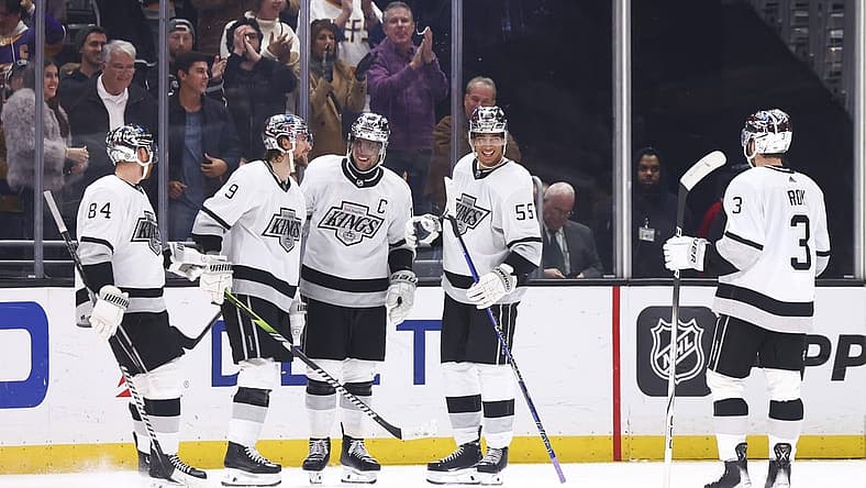 Dec 27, 2023; Los Angeles, California, USA; Los Angeles Kings right wing Adrian Kempe (9) celebrates with his teammates after scoring a goal during the third period of a game against the San Jose Sharks at Crypto.com Arena. Mandatory Credit: Jessica Alcheh-USA TODAY Sports