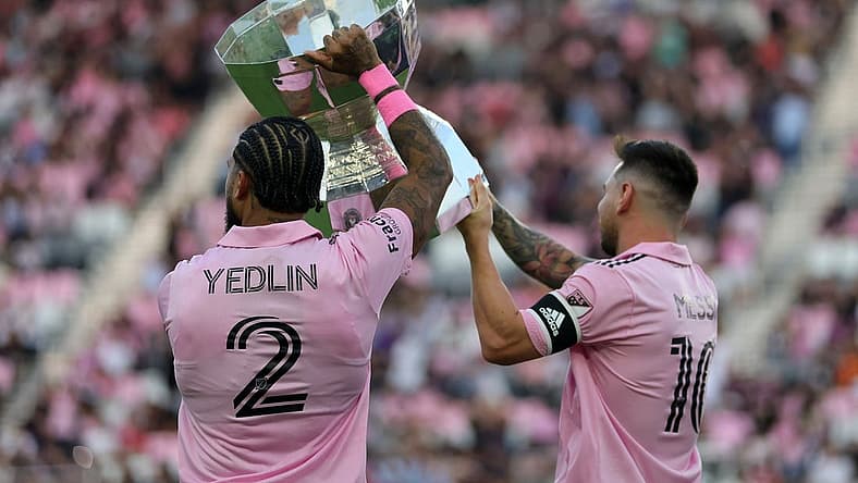 Aug 30, 2023; Fort Lauderdale, Florida, USA; Inter Miami defender DeAndre Yedlin (2) and forward Lionel Messi (10)  hoist the Leagues Cup trophy before the game against Nashville SC at DRV PNK Stadium. Mandatory Credit: Sam Navarro-USA TODAY Sports