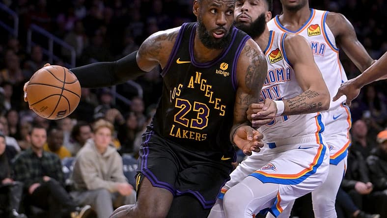 Jan 15, 2024; Los Angeles, California, USA; Los Angeles Lakers forward LeBron James (23) drives past Oklahoma City Thunder guard Cason Wallace (22) in the first half at Crypto.com Arena. Mandatory Credit: Jayne Kamin-Oncea-USA TODAY Sports