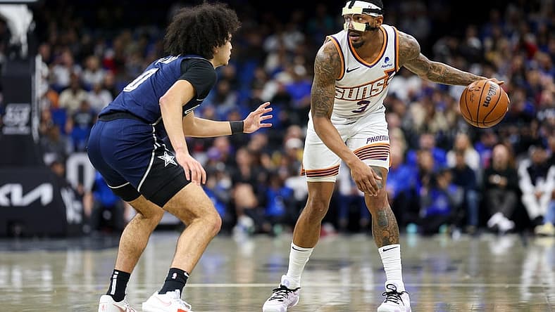 Jan 28, 2024; Orlando, Florida, USA; Phoenix Suns guard Bradley Beal (3) controls the ball from Orlando Magic guard Anthony Black (0) in the second quarter at the Kia Center. Mandatory Credit: Nathan Ray Seebeck-USA TODAY Sports