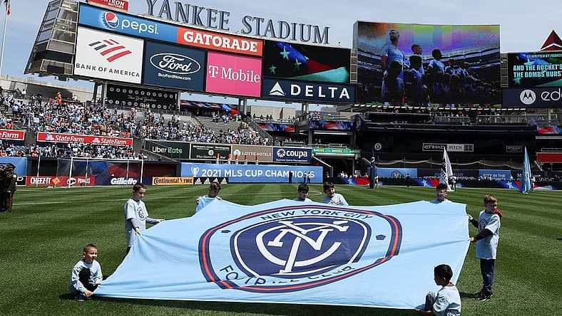 May 1, 2022; New York, New York, USA; Young fans hold a New York City FC banner on the pitch before the game against the San Jose Earthquakes at Yankee Stadium. Mandatory Credit: Vincent Carchietta-USA TODAY Sports