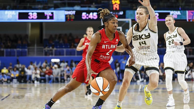 Jun 17, 2022; Chicago, Illinois, USA; Atlanta Dream guard Aari McDonald (2) drives to the basket against Chicago Sky guard Allie Quigley (14) during the first half of a WNBA game at Wintrust Arena. Mandatory Credit: Kamil Krzaczynski-USA TODAY Sports