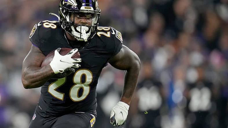 Baltimore Ravens running back Mike Davis (28) carries the ball in the second quarter during an NFL Week 5 game against the Cincinnati Bengals, Sunday, Oct. 9, 2022, at M&T Bank Stadium in Baltimore.
Nfl Cincinnati Bengals At Baltimore Ravens Oct 9 0176