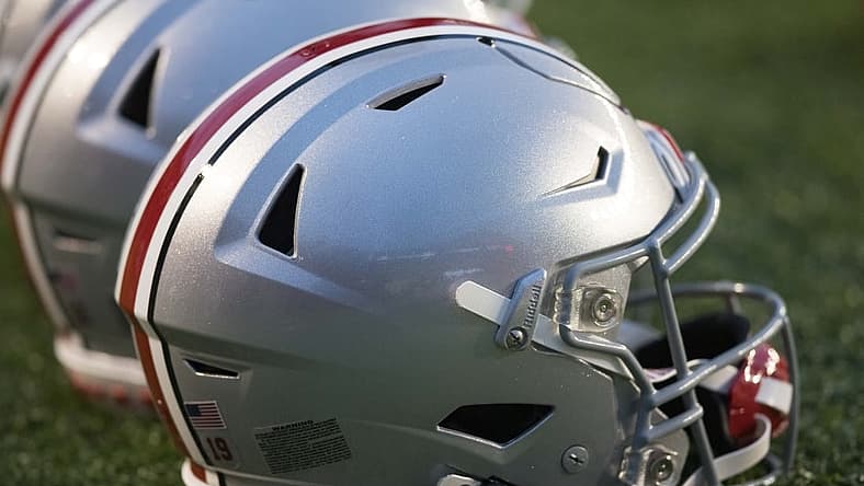 Oct 28, 2023; Madison, Wisconsin, USA; Ohio State Buckeyes helmets sit on the field during warmups prior to the game against the Wisconsin Badgers at Camp Randall Stadium. Mandatory Credit: Jeff Hanisch-USA TODAY Sports