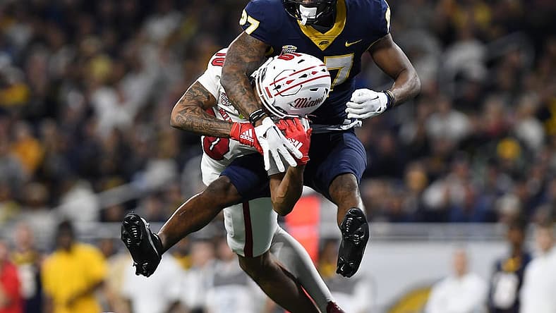Toledo Rockets cornerback Quinyon Mitchell (27) breaks up a pass intended for Miami (OH) Redhawks wide receiver Gage Larvadain (10) in the third quarter at Ford Field. Mandatory Credit: Lon Horwedel-USA TODAY Sports