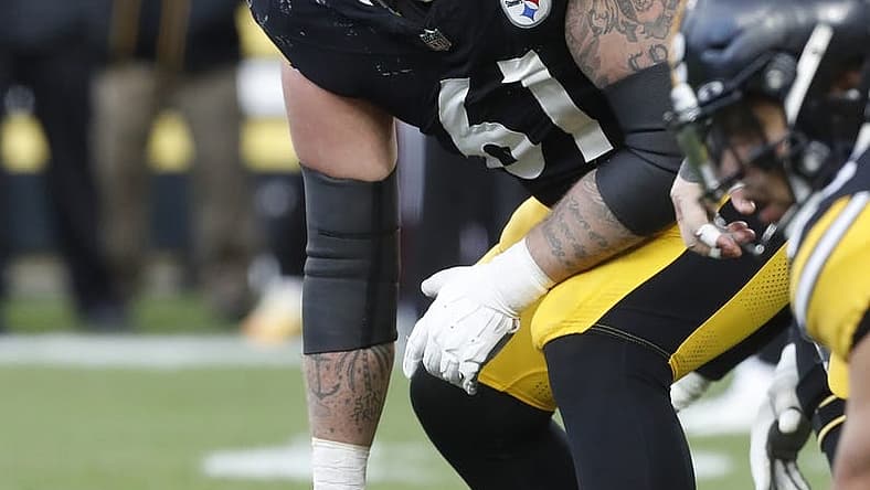 Dec 3, 2023; Pittsburgh, Pennsylvania, USA; Pittsburgh Steelers center Mason Cole (61) looks down the line of scrimmage against the Arizona Cardinals during the third quarter at Acrisure Stadium. Mandatory Credit: Charles LeClaire-USA TODAY Sports