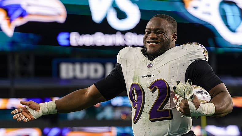 Dec 17, 2023; Jacksonville, Florida, USA; Baltimore Ravens defensive tackle Justin Madubuike (92) celebrates after beating the Jacksonville Jaguars at EverBank Stadium. Mandatory Credit: Nathan Ray Seebeck-USA TODAY Sports