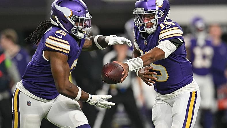 Nov 27, 2023; Minneapolis, Minnesota, USA; Minnesota Vikings quarterback Joshua Dobbs (15) hands the ball off to running back Alexander Mattison (2) during the game against the Chicago Bears at U.S. Bank Stadium. Mandatory Credit: Jeffrey Becker-USA TODAY Sports