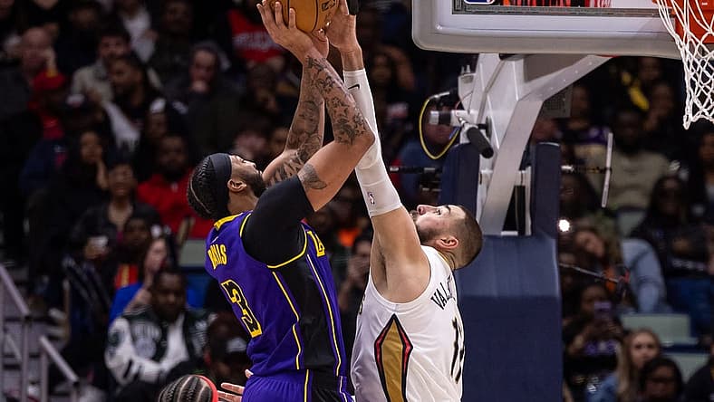 Dec 31, 2023; New Orleans, Louisiana, USA; New Orleans Pelicans center Jonas Valanciunas (17) blocks the jump shot attempt by Los Angeles Lakers forward Anthony Davis (3) during the second half at Smoothie King Center. Mandatory Credit: Stephen Lew-USA TODAY Sports