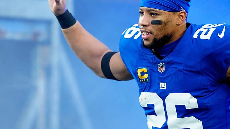 New York Giants running back Saquon Barkley (26) takes the field at MetLife Stadium, Sunday, January 7, 2024.