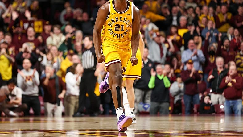 Feb 3, 2024; Minneapolis, Minnesota, USA; Minnesota Golden Gophers forward Pharrel Payne (21) celebrates his dunk against the Northwestern Wildcats during overtime at Williams Arena. Mandatory Credit: Matt Krohn-USA TODAY Sports
