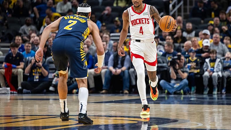 Feb 6, 2024; Indianapolis, Indiana, USA; Houston Rockets guard Jalen Green (4) dribbles the ball while Indiana Pacers guard Andrew Nembhard (2) defends in the first half at Gainbridge Fieldhouse. Mandatory Credit: Trevor Ruszkowski-USA TODAY Sports