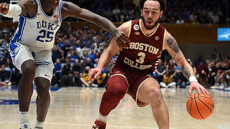 Feb 10, 2024; Durham, North Carolina, USA; Boston College Eagles guard Jaeden Zackery (3) controls the ball against Duke Blue Devils forward Mark Mitchell (25) during the first half at Cameron Indoor Stadium. Mandatory Credit: Rob Kinnan-USA TODAY Sports