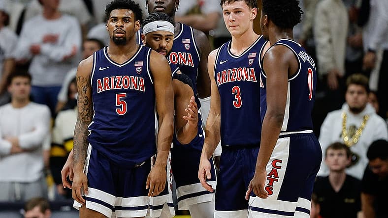 Feb 10, 2024; Boulder, Colorado, USA; Arizona Wildcats guard KJ Lewis (5) and guard Kylan Boswell (4) and center Oumar Ballo (11) and guard Pelle Larsson (3) and guard Jaden Bradley (0) in the first half against the Colorado Buffaloes at CU Events Center. Mandatory Credit: Isaiah J. Downing-USA TODAY Sports