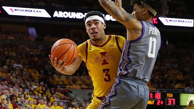 Iowa State Cyclones guard Tamin Lipsey (3) lays up the ball around TCU Horned Frogs guard Micah Peavy (0) during the second half in the Big-12 conference showdown of a NCAA college basketball at Hilton Coliseum on Saturday, Feb. 10, 2024, in Ames, Iowa.
