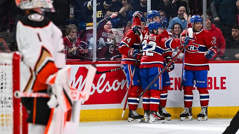 Feb 13, 2024; Montreal, Quebec, CAN; Montreal Canadiens center Nick Suzuki (14) celebrates his first goal of the game against the Anaheim Ducks with his teammates during the second period at Bell Centre. Mandatory Credit: David Kirouac-USA TODAY Sports