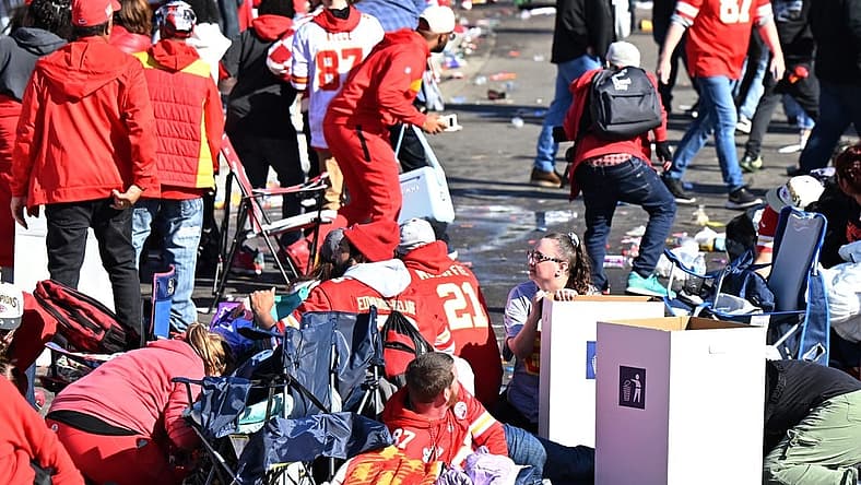 Feb 14, 2024; Kansas City, MO, USA; Fans shelter in place after shots were fired after the celebration of the Kansas City Chiefs winning Super Bowl LVIII. Mandatory Credit: David Rainey-USA TODAY Sports