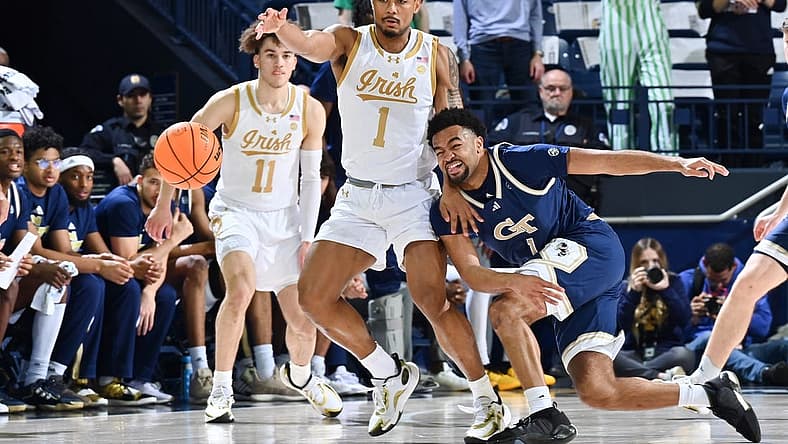 Feb 14, 2024; South Bend, Indiana, USA; Georgia Tech Yellow Jackets guard Kyle Sturdivant (1) knocks the ball away from Notre Dame Fighting Irish guard Julian Roper II (1) in the first half at the Purcell Pavilion. Mandatory Credit: Matt Cashore-USA TODAY Sports
