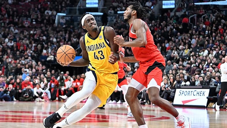 Feb 14, 2024; Toronto, Ontario, CAN; Indiana Pacers forward Pascal Siakam (43) drives to the basket against Toronto Raptors guard Immanuel Quickley (5) in the first half at Scotiabank Arena. Mandatory Credit: Dan Hamilton-USA TODAY Sports