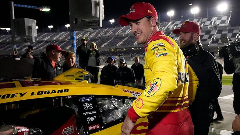 Joey Logano is all smiles after winning the pole for the Daytona 500 during pole qualifying at Daytona International Speedway, Wednesday, Feb. 14, 2024.