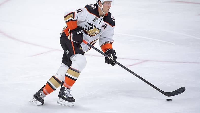 Feb 15, 2024; Ottawa, Ontario, CAN; Anaheim Ducks defenseman Cam Fowler (4) skates with the puck in the third period against the Ottawa Senators at the Canadian Tire Centre. Mandatory Credit: Marc DesRosiers-USA TODAY Sports