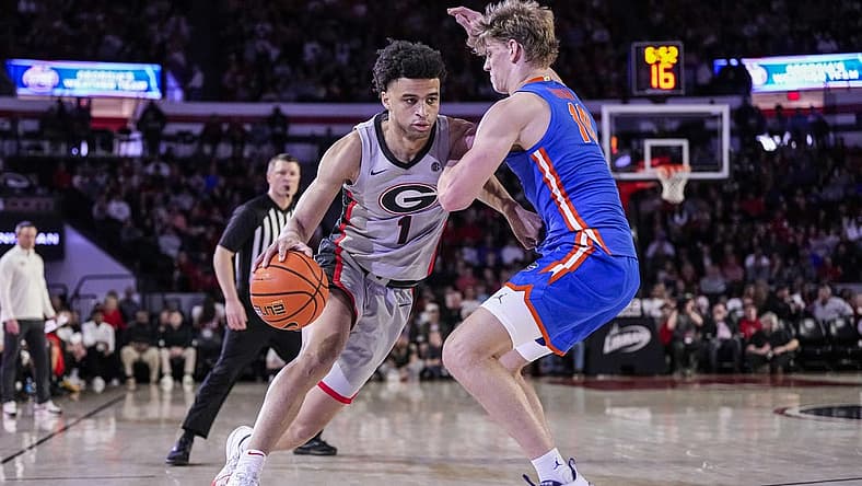 Feb 17, 2024; Athens, Georgia, USA; Georgia Bulldogs guard Jabri Abdur-Rahim (1) dribbles against Florida Gators forward Thomas Haugh (10) during the first half at Stegeman Coliseum. Mandatory Credit: Dale Zanine-USA TODAY Sports