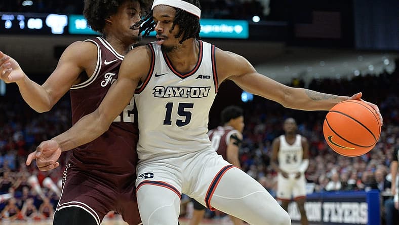 Feb 17, 2024; Dayton, Ohio, USA; Dayton Flyers forward DaRon Holmes II (15) is fouled by Fordham Rams forward Elijah Gray (12) during a game at University of Dayton Arena. Mandatory Credit: Matt Lunsford-USA TODAY Sports