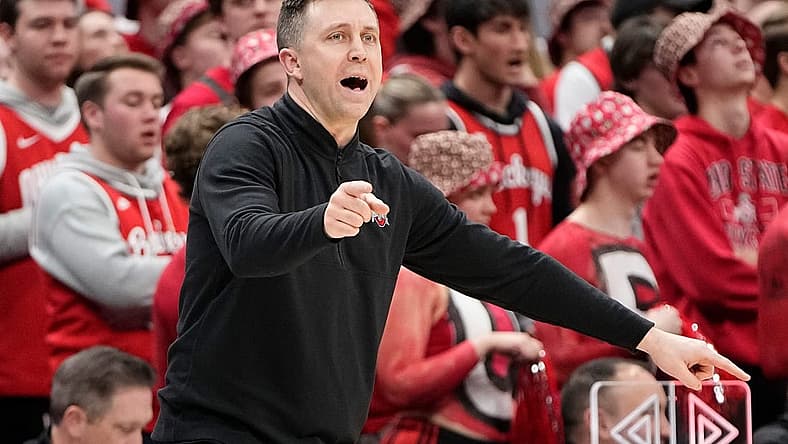 Feb 18, 2024; Columbus, Ohio, USA; Ohio State Buckeyes interim head coach Jake Diebler motions from the bench during the second half of the NCAA men s basketball game against the Purdue Boilermakers at Value City Arena. Ohio State won 73-69.