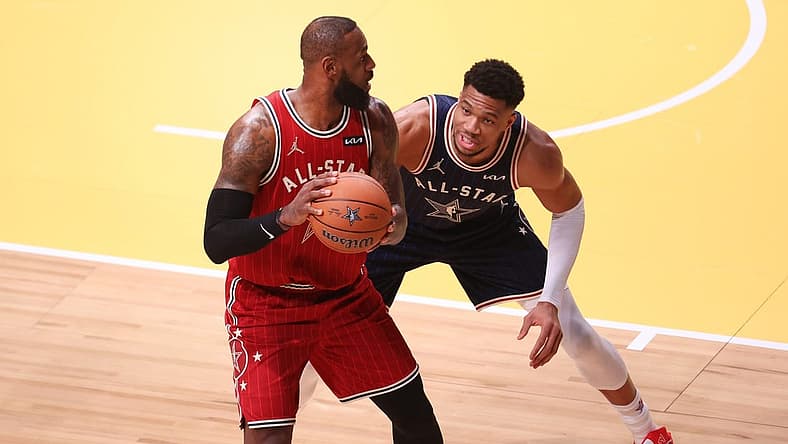 Feb 18, 2024; Indianapolis, Indiana, USA; Eastern Conference forward Giannis Antetokounmpo (34) of the Milwaukee Bucks defends Western Conference forward LeBron James (23) of the Los Angeles Lakers during the first quarter in the 73rd NBA All Star game at Gainbridge Fieldhouse. Mandatory Credit: Trevor Ruszkowski-USA TODAY Sports