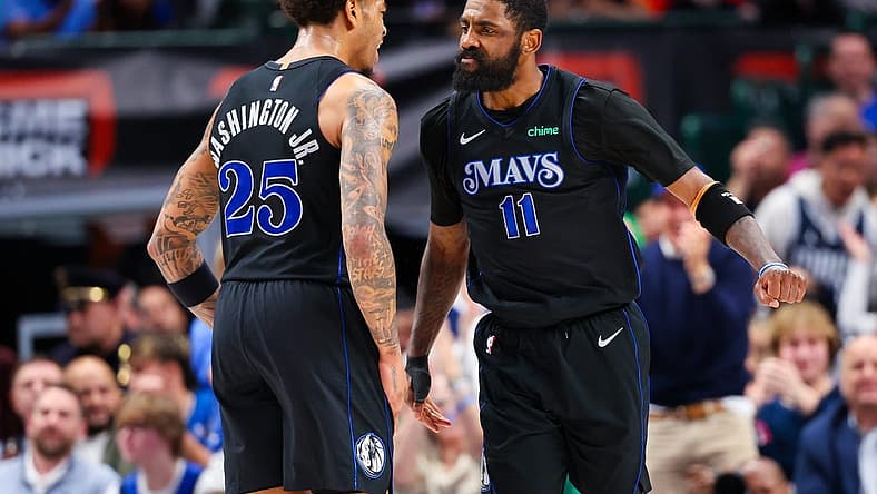 Feb 22, 2024; Dallas, Texas, USA; Dallas Mavericks guard Kyrie Irving (11) celebrates with Dallas Mavericks forward P.J. Washington (25) during the second half against the Phoenix Suns at American Airlines Center. Mandatory Credit: Kevin Jairaj-USA TODAY Sports