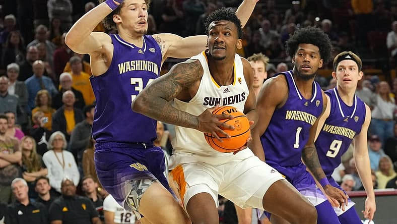 Feb 22, 2024; Tempe, Arizona, USA; Arizona State Sun Devils center Shawn Phillips Jr. (9) works under the basket against Washington Huskies center Braxton Meah (34) during the second half at Desert Financial Arena. Mandatory Credit: Joe Camporeale-USA TODAY Sports